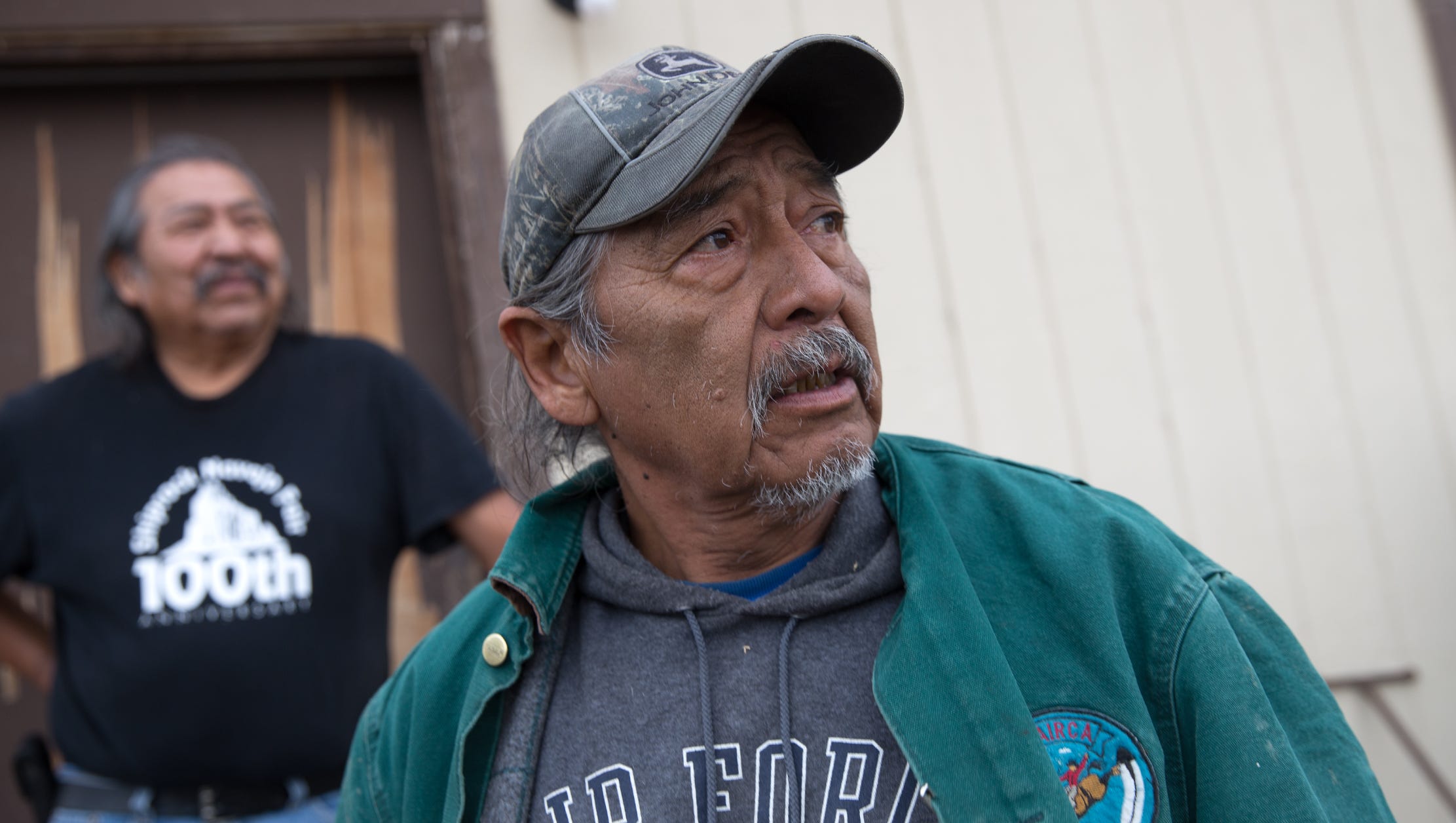 At right, Joe Ben Jr., a former Shiprock Chapter Farm Board member who served during the Gold King Mine spill, talks on Friday about his dissatisfaction with the U.S. Environmental Protection Agency after it announced it will not pay claims filed against it in response to the spill. Ben speaks at the farm of Earl Yazzie, pictured at left, in Shiprock.