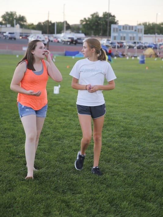Maddison Trotter, left, and Clara Vander Hoven take part in Saturday's Relay for Life at the Boys & Girls Clubs of Farmington football field.
