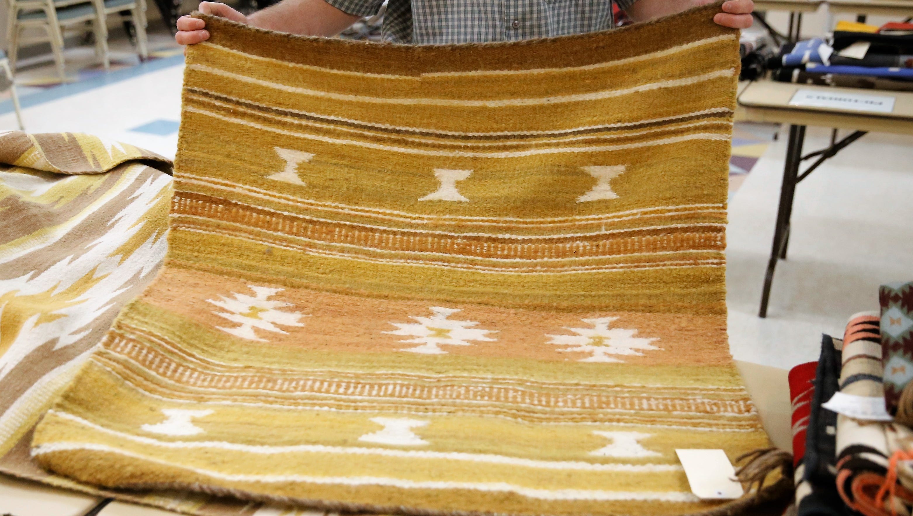 This weaving from the Crystal Trading Post is one of approximately 200 that will be offered for sale during Saturday's annual Navajo Benefit Rug Auction at the Farmington Museum at Gateway Park.