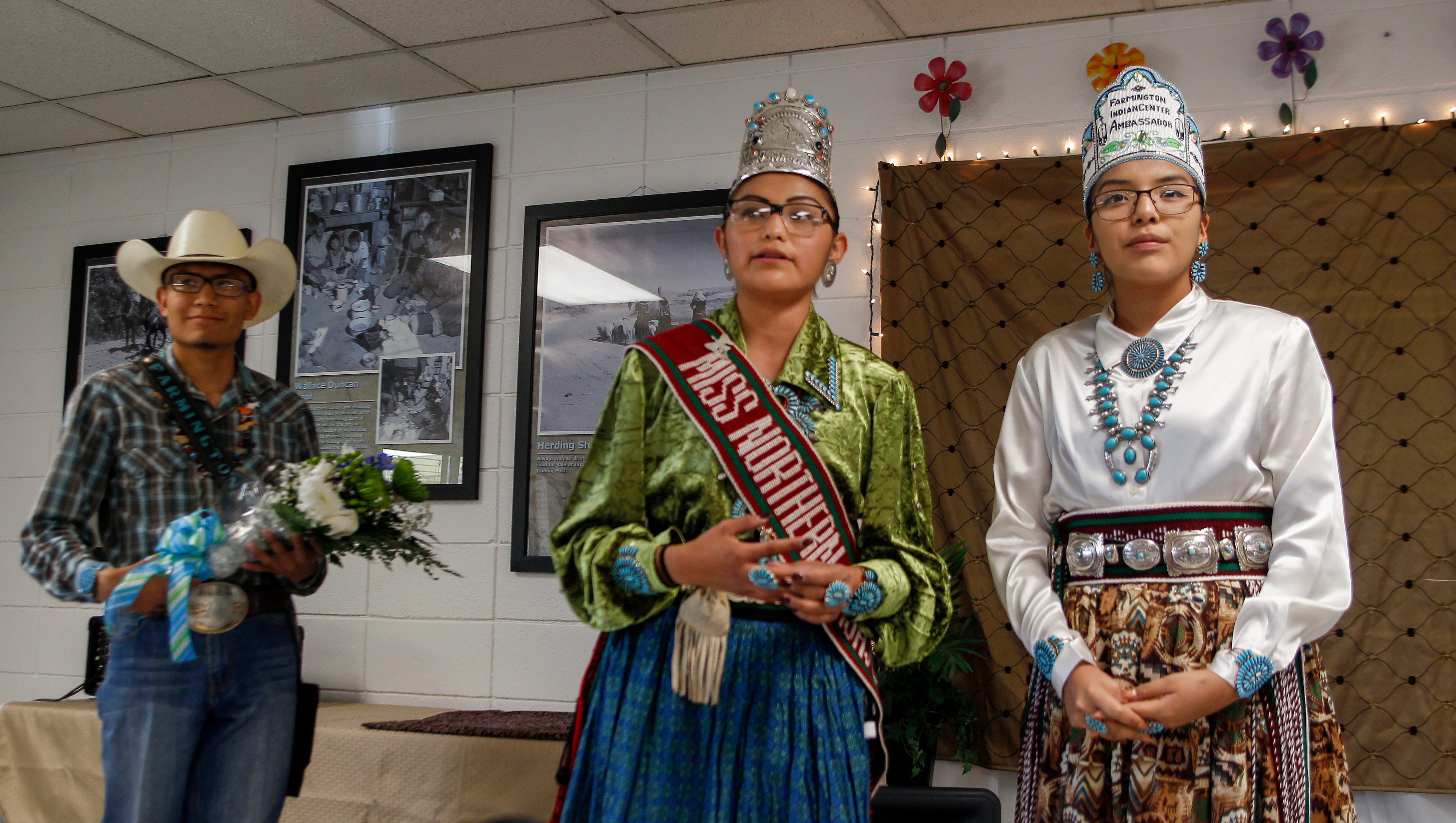 Outgoing Farmington American Indian Ambassador Christopher Taylor Benally and Miss Northern Navajo Ariana Roselyn Young congratulate newly crowned Farmington American Indian Ambassador Nikeisha Kee Thursday during a ceremony at the Farmington Indian Center.