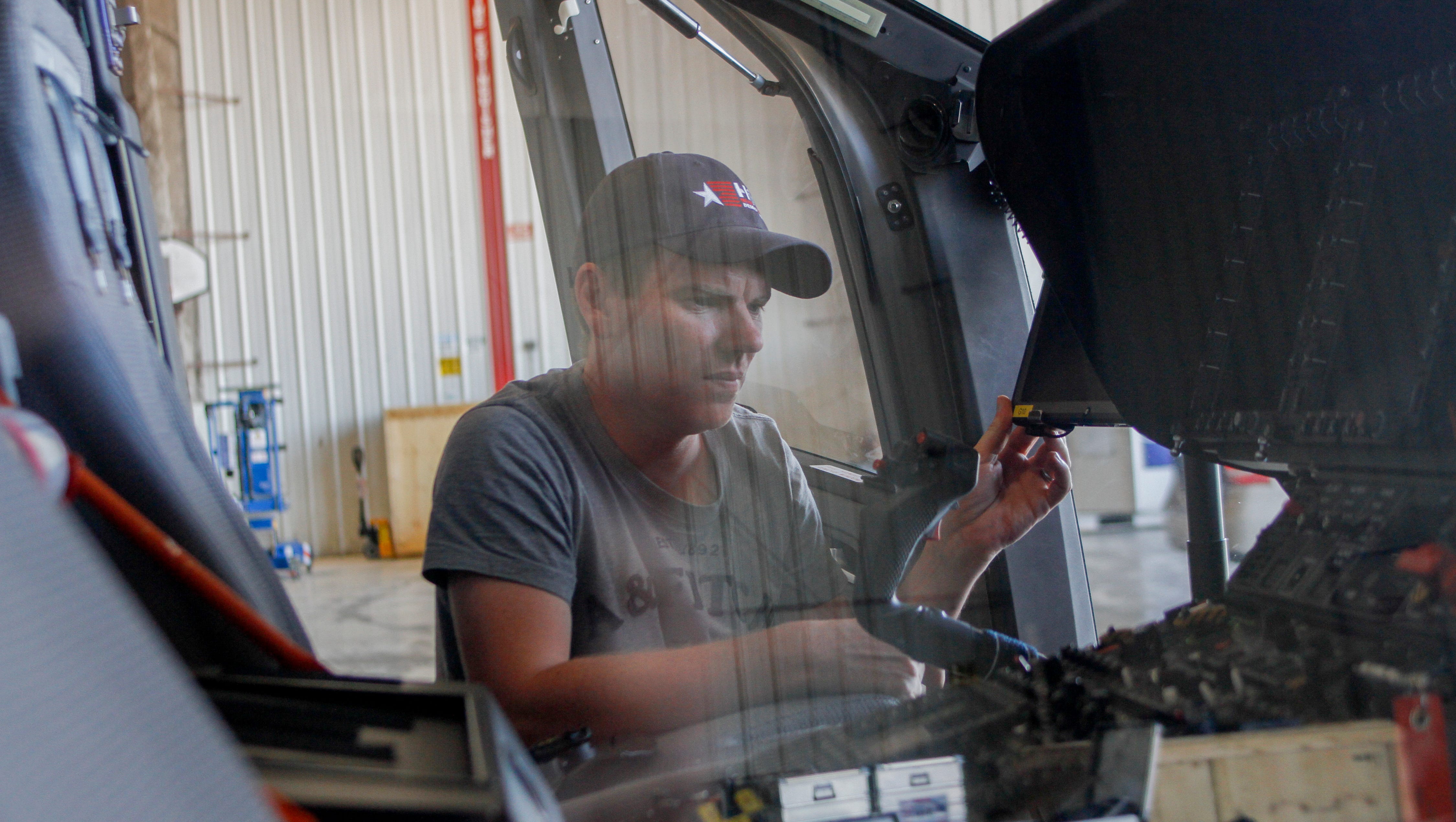 Gregory LePage, a flight test instrumentation engineer for Airbus Helicopters, works on the H160 helicopter Tuesday at the Four Corners Regional Airport in Farmington.