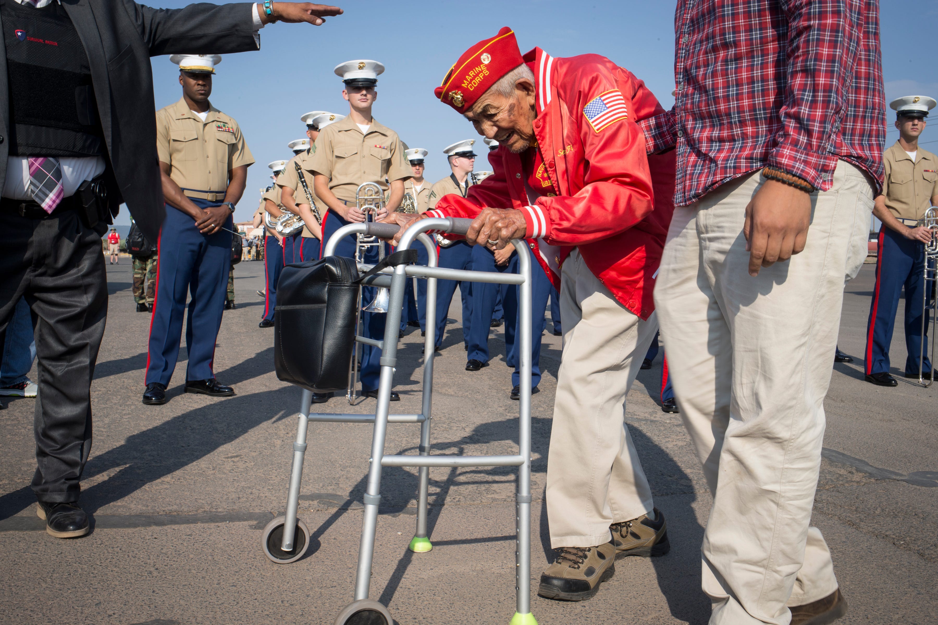 Navajo Code Talker Alfred Newman is helped to his vehicle by his grandson William Newman before the start of the Navajo Nation Code Talkers Day parade Aug. 14, 2018, at the Navajo Nation Fairgrounds in Window Rock.