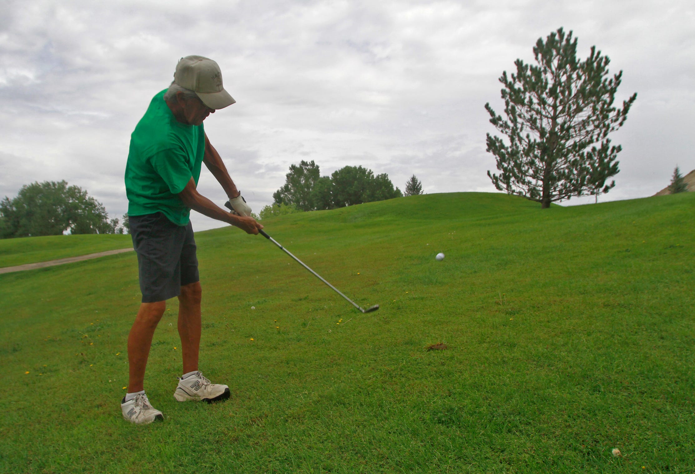 Pete McKinnon hits his ball, Thursday, Aug. 18, 2016 during a golf game at Aztec Municipal Golf Course in this file photo. The course could close by the end of the year.