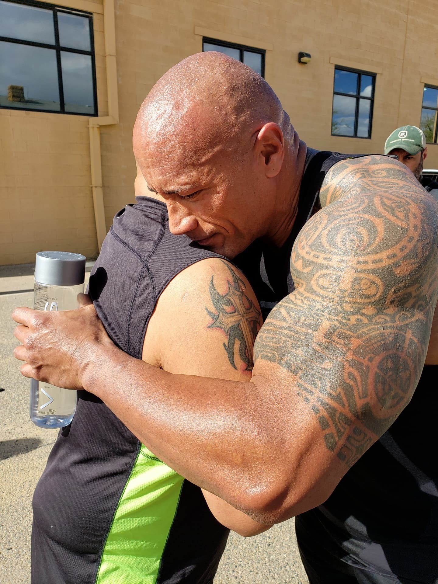 Actor Dwayne "The Rock" Johnson hugs Farmington resident Leonard Castillo on April 26 in Farmington.