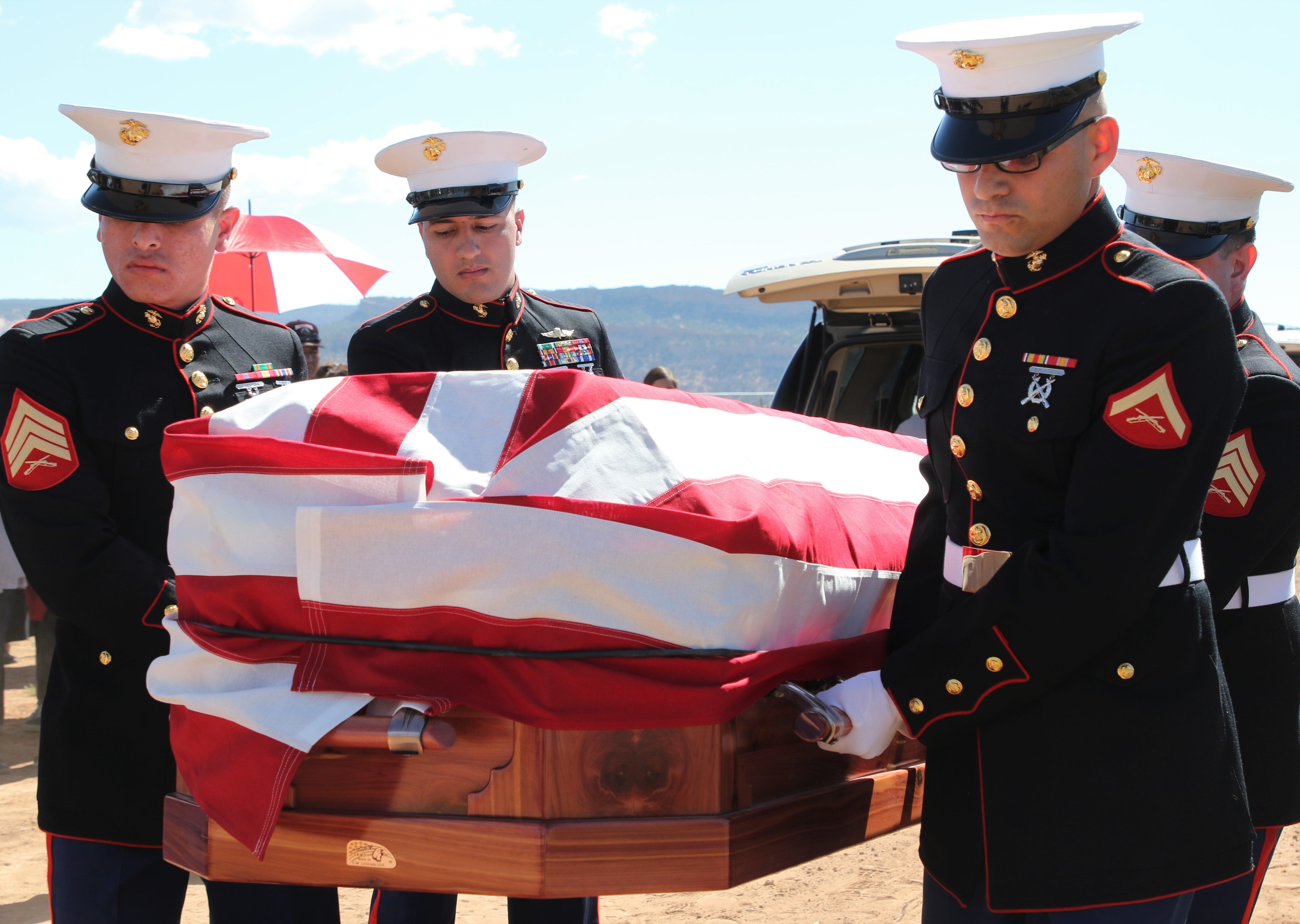 Members of the U.S. Marine Corps Delta Company, 4th Recon from Albuquerque carry the casket of Navajo Code Talker William Tully Brown Sr. on June 6 at the Fort Defiance Veterans Cemetery in Fort Defiance, Ariz.
