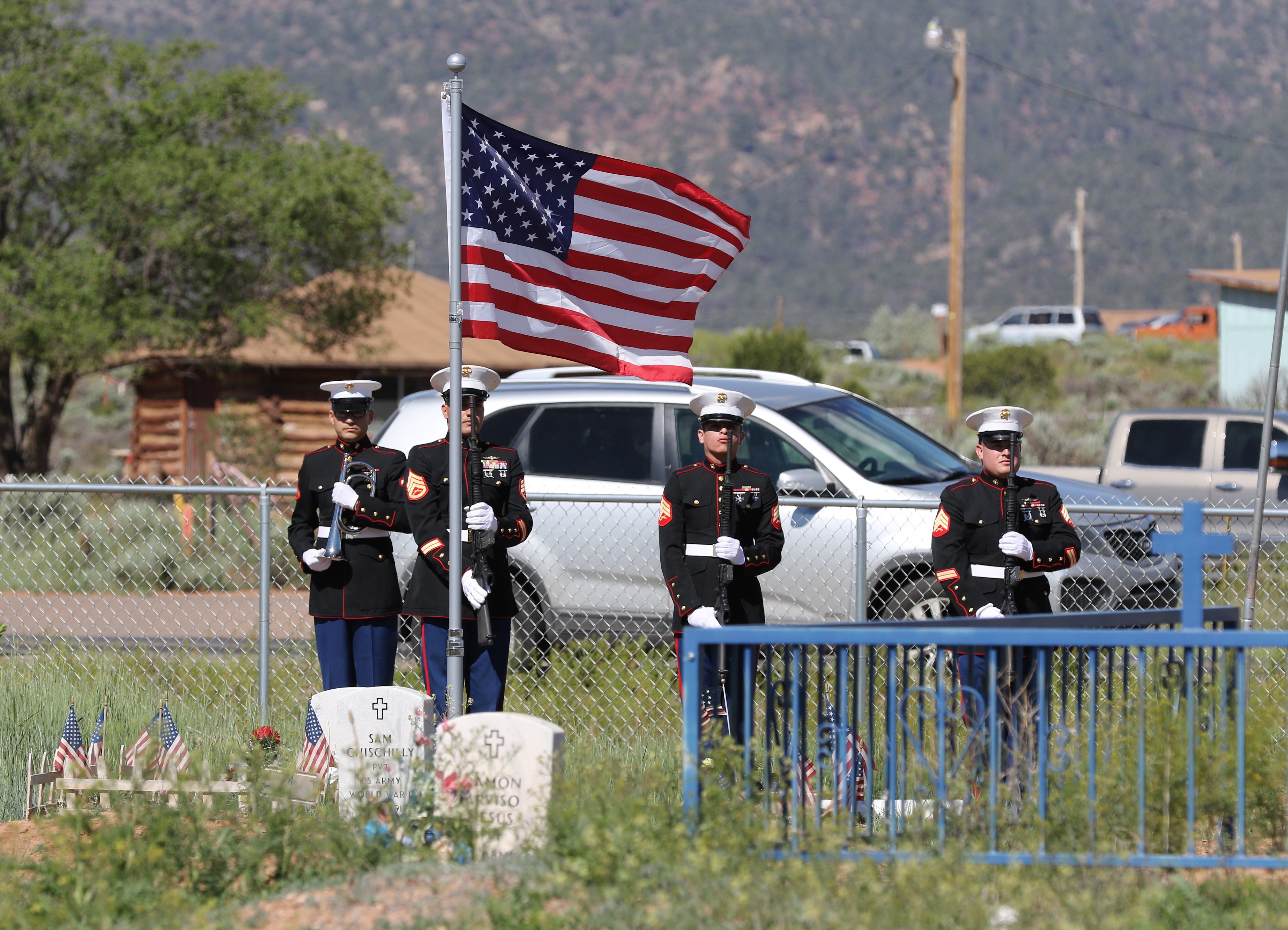 Members of the U.S. Marine Corps Delta Company, 4th Recon from Albuquerque wait to perform a rifle detail and the playing of taps at the June 6 memorial service for Navajo Code Talker William Tully Brown Sr. at the Fort Defiance Veterans Cemetery in Fort Defiance, Ariz.