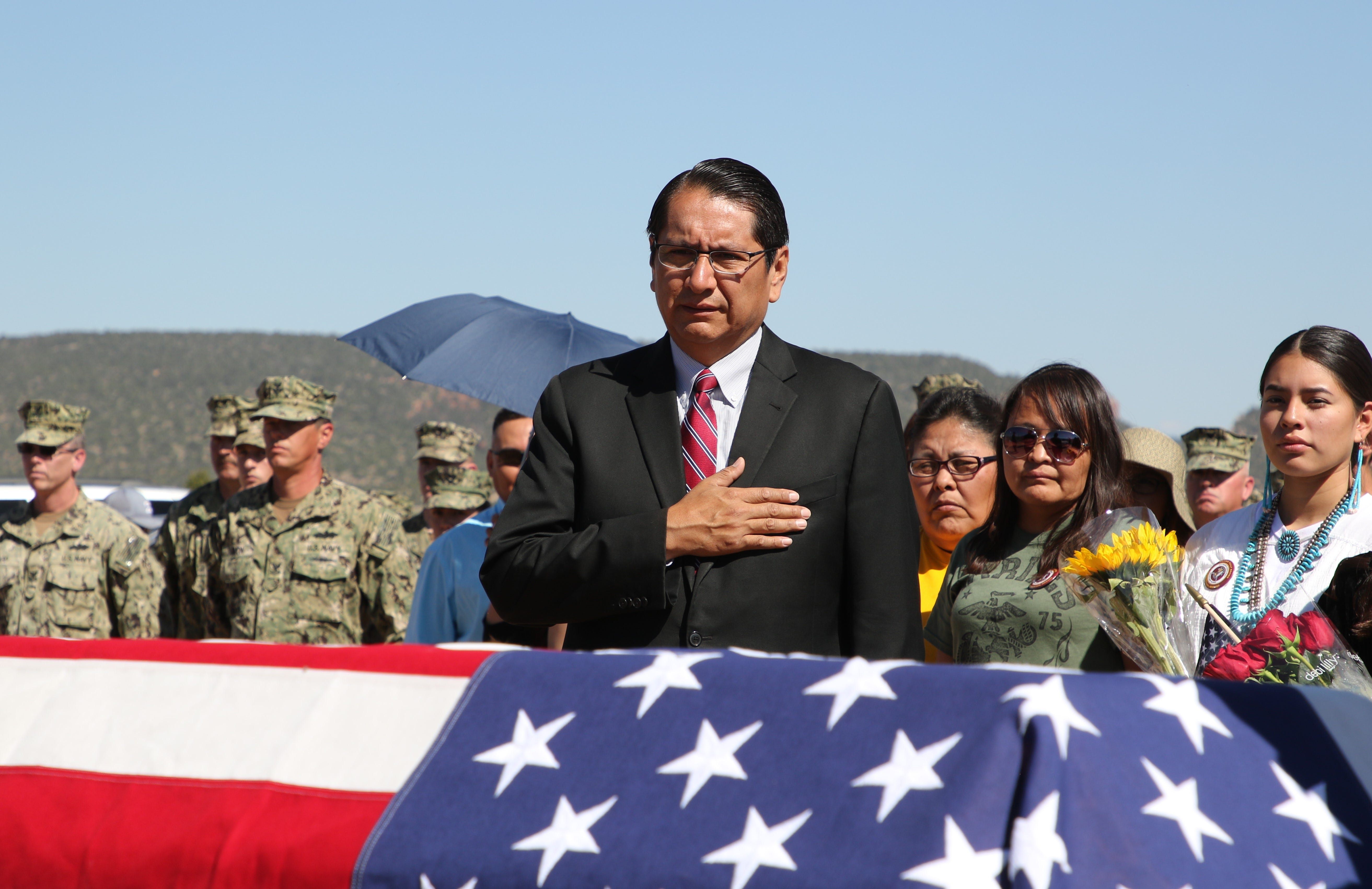 Navajo Nation President Jonathan Nez pays his respects to Navajo Code Talker William Tully Brown Sr. during the June 6 memorial service at the Fort Defiance Veterans Cemetery in Fort Defiance, Ariz.