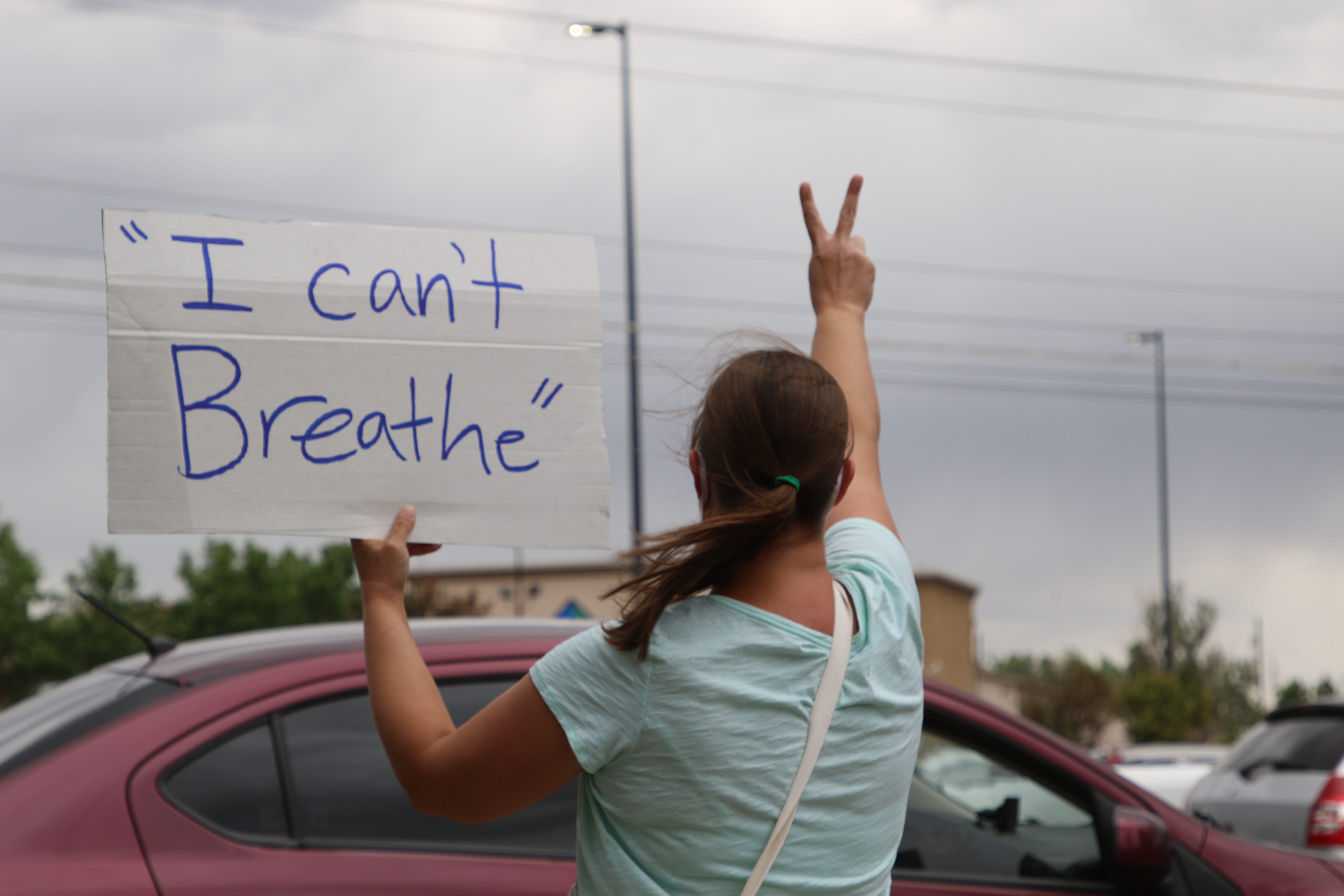 A community member flashes the peace sign during a protest on June 1 near the Animas Valley Mall in Farmington that called for justice in George Floyd's death in Minneapolis.