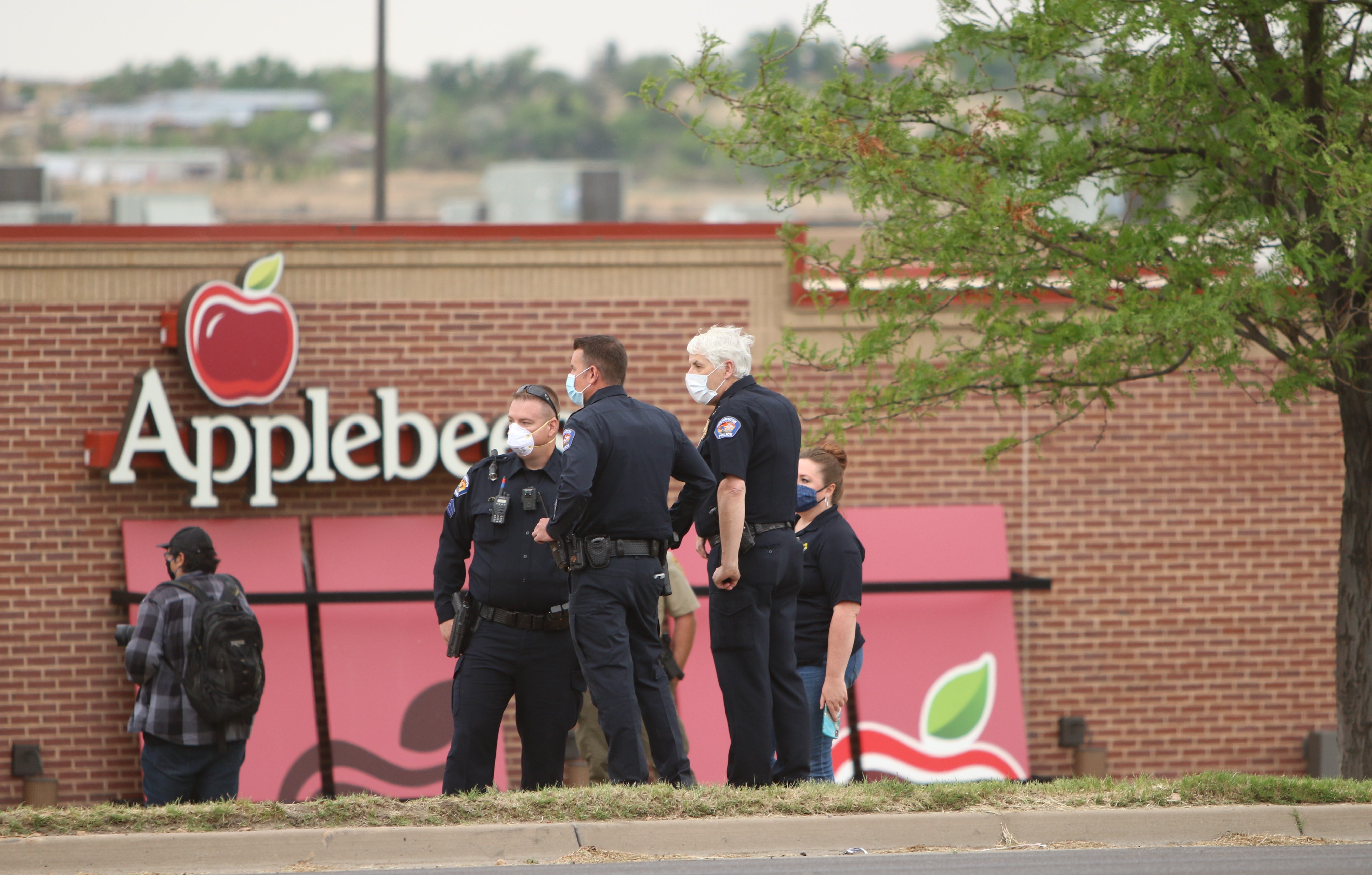 Farmington Police Chief Steve Hebbe, right, stands with officers during a protest on June 1 near Animas Valley Mall that called for justice in George Floyd's death in Minneapolis.