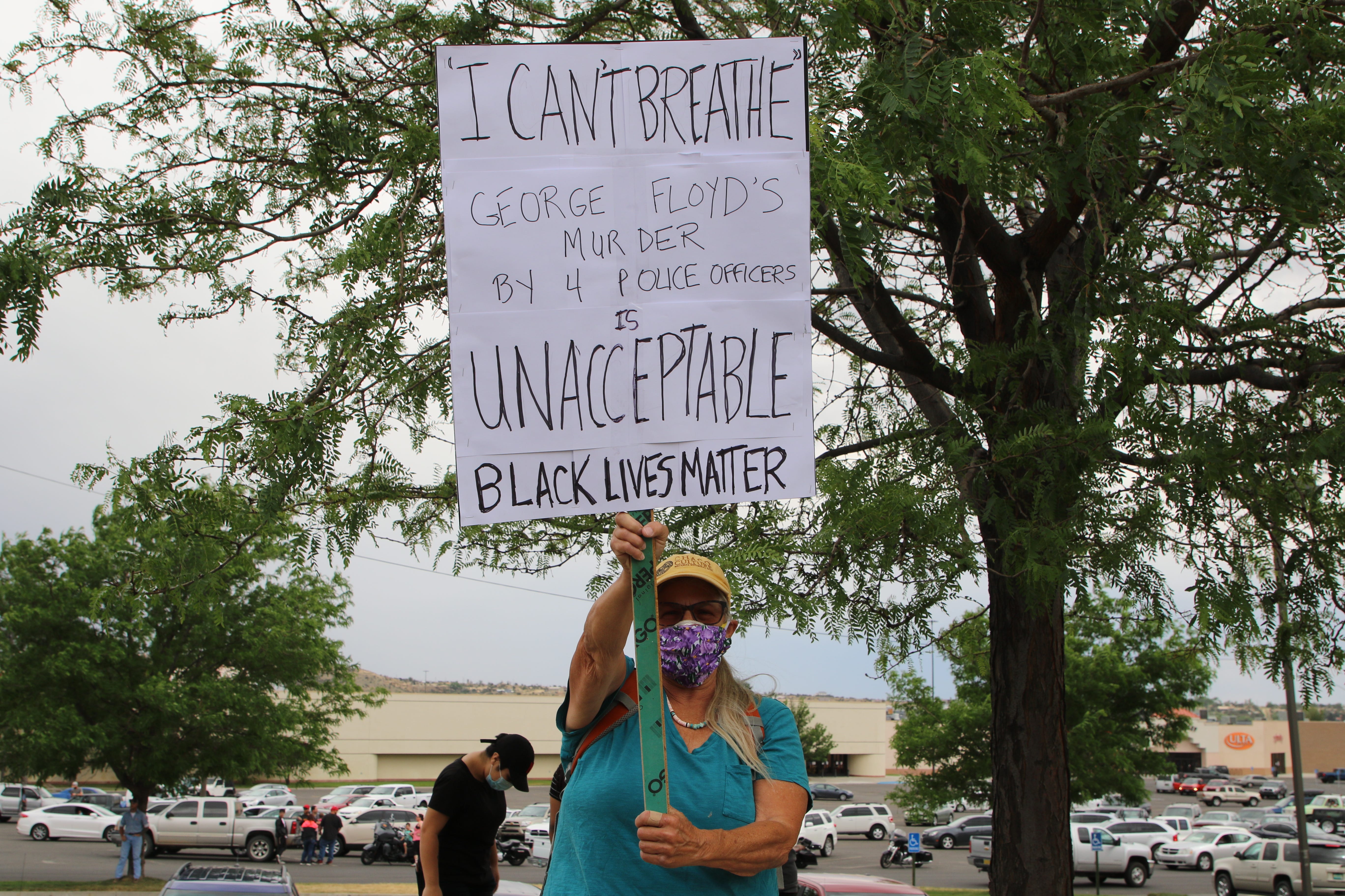Linda Wheelbarger holds a sign during a protest on June 1 near Animas Valley Mall in Farmington that focused on the death of George Floyd in Minneapolis.