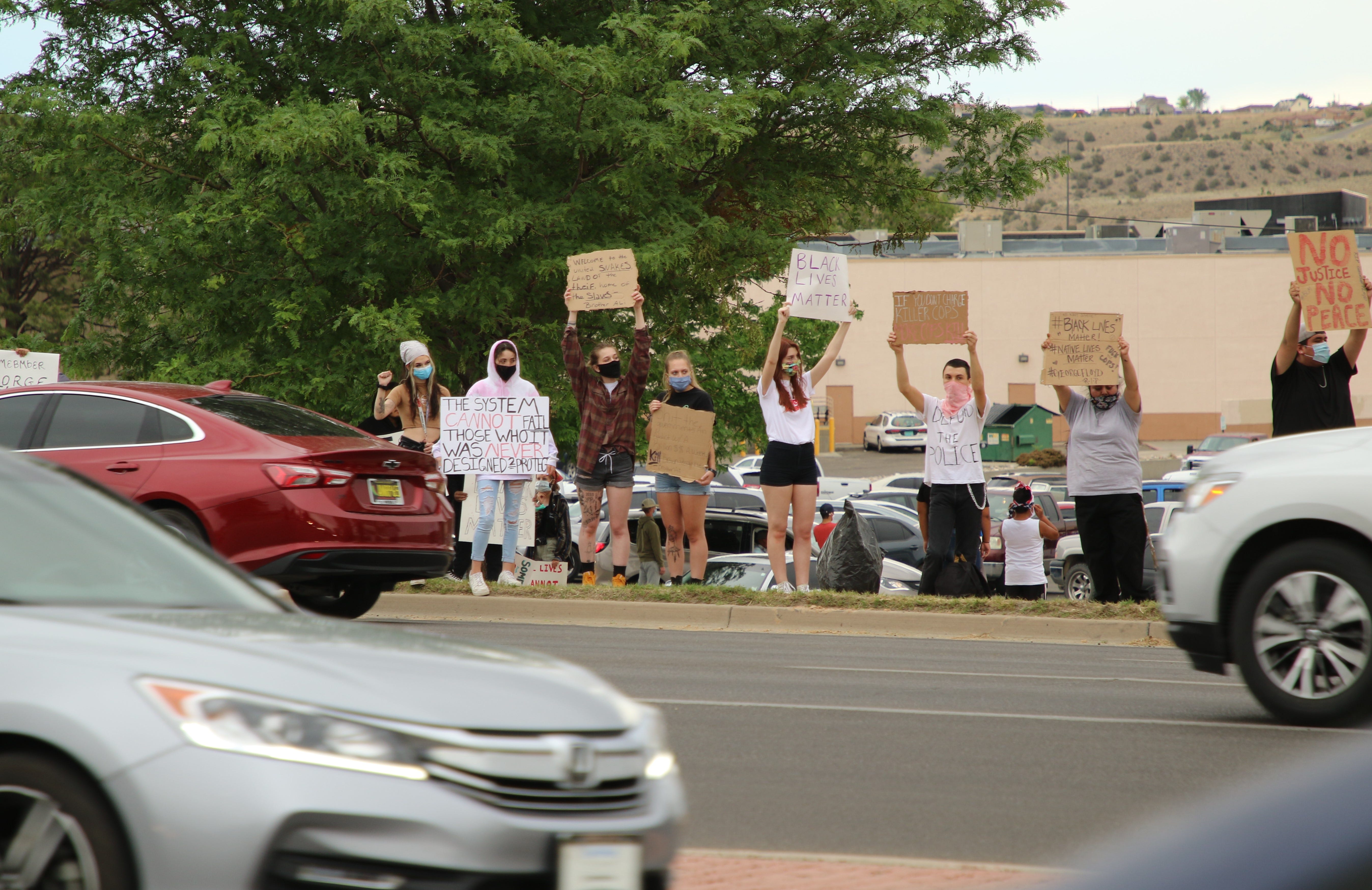 Community members stand along East Main Street in Farmington during a protest on June 1 that called for justice in George Floyd's death in Minneapolis.