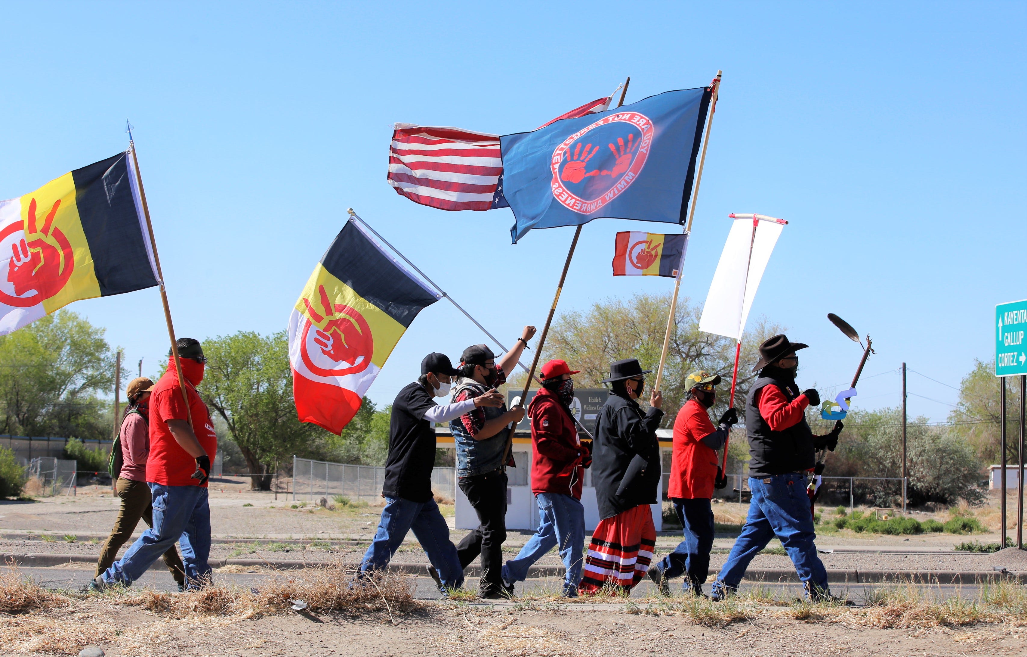 Participants walk along U.S. Highway 64 during the Missing and Murdered Indigenous Women Memorial Honor Walk on May 5 in Shiprock.
