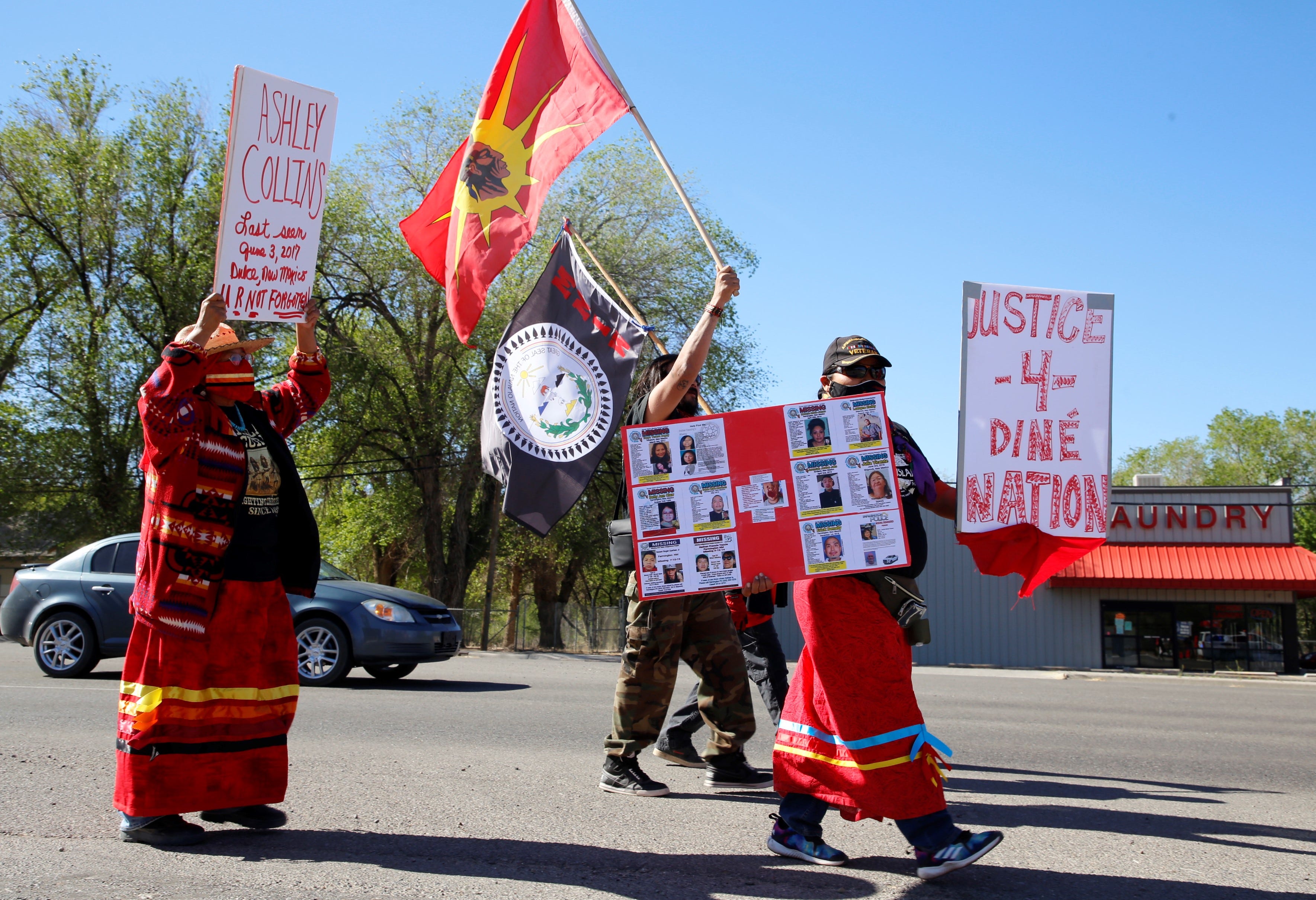 Participants in the Missing and Murdered Indigenous Women Memorial Honor Walk proceed on May 5 on U.S. Highway 64 in Shiprock.