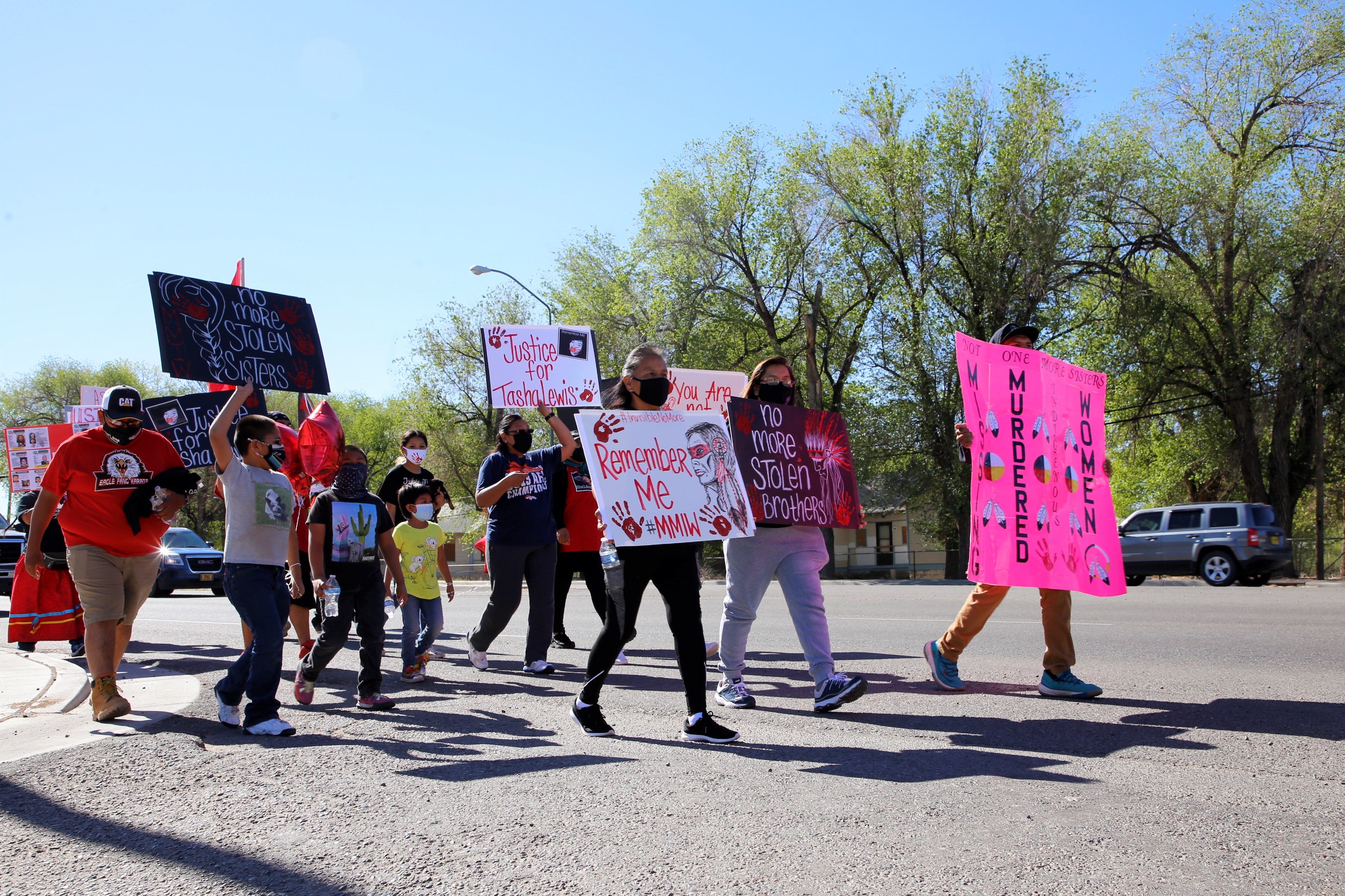 The Missing and Murdered Indigenous Women Memorial Honor Walk proceeds on May 5 on U.S. Highway 64 in Shiprock.