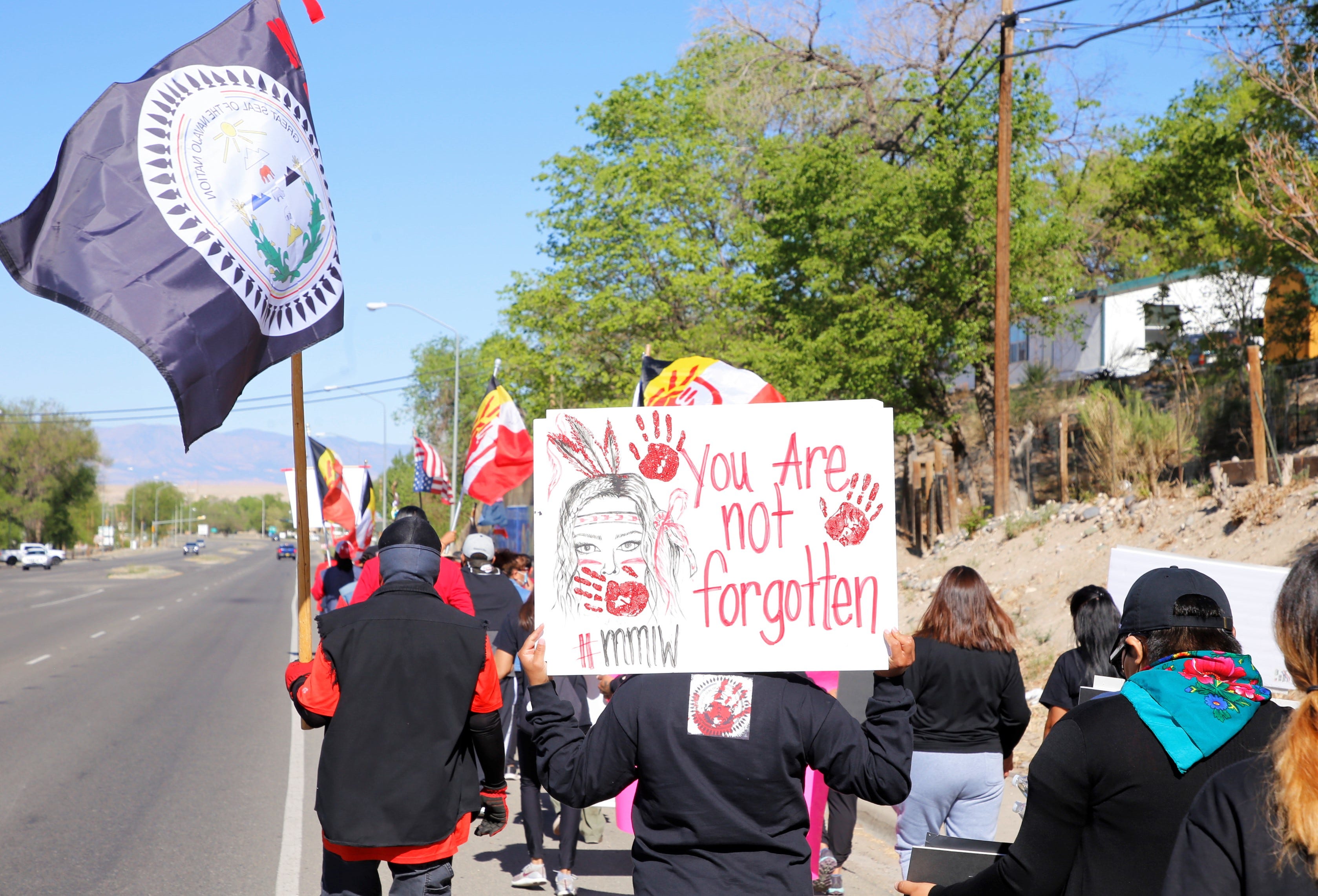 Participants carried signs with messages about Missing and Murdered Indigenous Women during the May 5 walk in Shiprock.